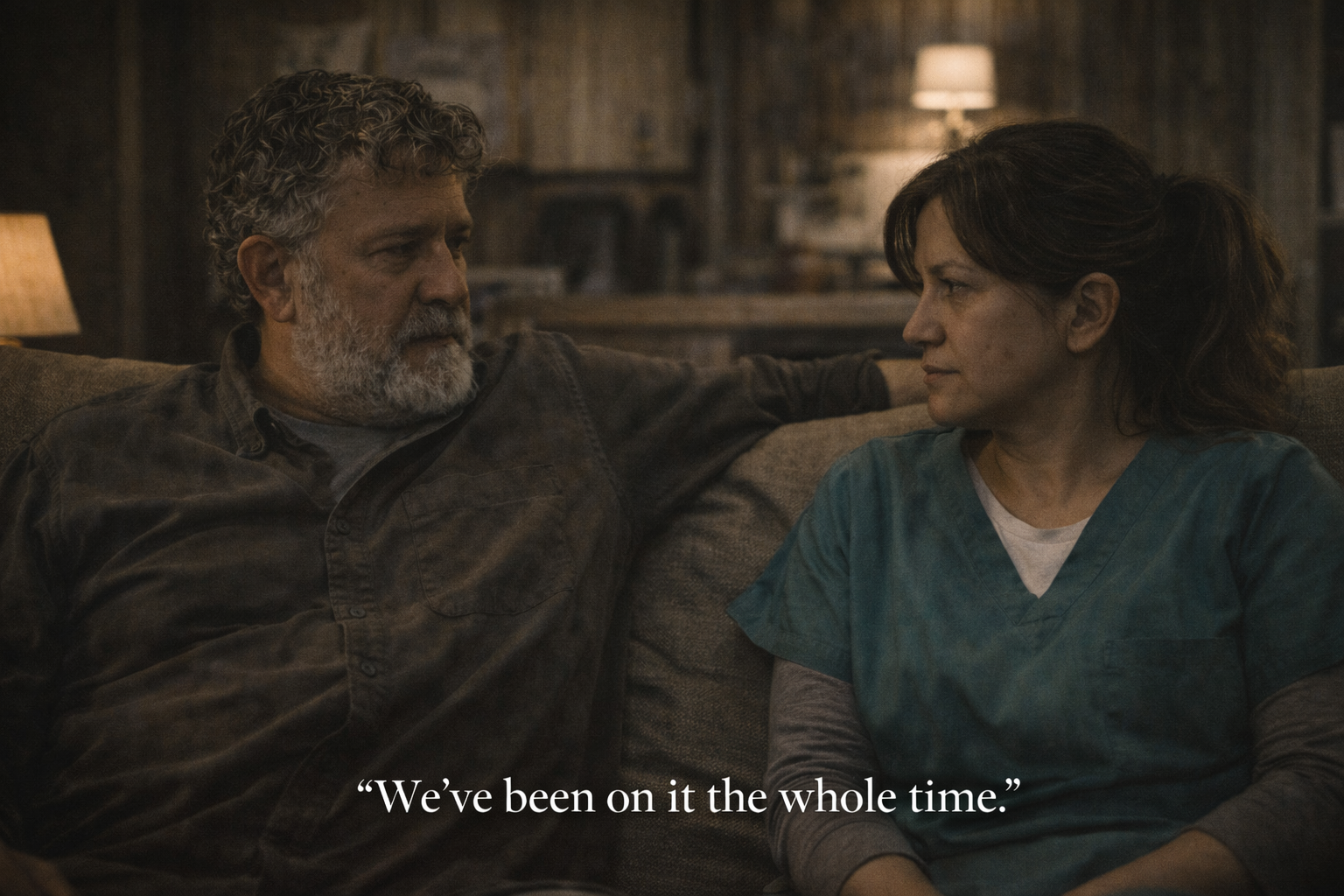 Gil and Destiny on the trailer couch as the truth beneath the town is finally spoken aloud